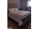 Bedroom featuring tufted headboard, plush bedding and natural light at 5840 Butner Rd, South Fulton, GA 30349