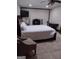 Bedroom featuring a bed, TV, fireplace, and tile flooring at 5840 Butner Rd, South Fulton, GA 30349