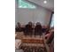 Dining room features a formal dining table and chairs, with wood flooring and natural light at 5840 Butner Rd, South Fulton, GA 30349