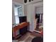 Cozy living room with window, console table and a view into the kitchen at 5840 Butner Rd, South Fulton, GA 30349