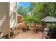 Backyard showing lush landscaping, a patio, and a covered BBQ area for outdoor relaxation and entertainment at 3245 Bywater Trl, Roswell, GA 30075