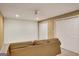 Finished basement featuring neutral walls and carpet, ceiling fan, with a couch at 3245 Bywater Trl, Roswell, GA 30075