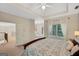 Bright bedroom with tray ceiling, large windows, plush carpet, and a comfortable bed at 3245 Bywater Trl, Roswell, GA 30075