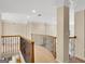 Open hallway with decorative iron railing and light-filled space at 3245 Bywater Trl, Roswell, GA 30075