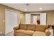 Cozy living room with neutral color palette and an inviting sofa, creating a warm and comfortable atmosphere at 3245 Bywater Trl, Roswell, GA 30075