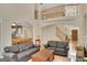 Open-concept living room with a large staircase and views into the breakfast nook at 3245 Bywater Trl, Roswell, GA 30075