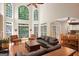 Spacious living room featuring soaring windows, providing abundant natural light at 3245 Bywater Trl, Roswell, GA 30075