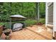 The patio area features a covered grill, clay tile flooring, and wooded views at 3245 Bywater Trl, Roswell, GA 30075