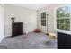 Well-lit bedroom features natural light, complemented by stylish decor at 942 Marta Crane Dr, Lawrenceville, GA 30045