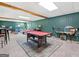 Spacious game room with a pool table, accent lighting and comfortable seating area at 942 Marta Crane Dr, Lawrenceville, GA 30045