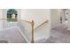 Upstairs hallway with white railing and neutral carpet at 942 Marta Crane Dr, Lawrenceville, GA 30045
