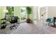 Bright home office with desk, chair, and natural light at 942 Marta Crane Dr, Lawrenceville, GA 30045