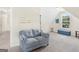 Cozy living room featuring plush seating, natural light, and neutral color palette at 942 Marta Crane Dr, Lawrenceville, GA 30045