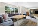 Open concept living room with large windows and comfortable seating area at 942 Marta Crane Dr, Lawrenceville, GA 30045