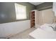 Bathroom with vanity, tub, and shelving for ample storage and a window for natural light at 178 S Old Highway 27, Roopville, GA 30170