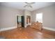 Bedroom with original hardwood floors, natural light, and closet space offers a cozy and functional space at 178 S Old Highway 27, Roopville, GA 30170