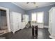 Bright bedroom with wood floors, blue walls, white dressers, and a window, creating a serene atmosphere at 178 S Old Highway 27, Roopville, GA 30170