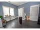 Charming bedroom with wood floors, blue walls, and bright windows, perfect for relaxation and comfort at 178 S Old Highway 27, Roopville, GA 30170