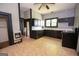 Functional kitchen featuring black appliances and cabinetry, with bright light, offers a practical cooking space at 178 S Old Highway 27, Roopville, GA 30170