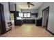 Functional kitchen featuring black appliances and cabinetry, with bright light, offers a practical cooking space at 178 S Old Highway 27, Roopville, GA 30170