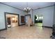 Open-concept living area with connecting spaces and ample natural light offers versatile possibilities for layout and design at 178 S Old Highway 27, Roopville, GA 30170