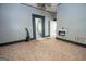 Inviting living room featuring neutral walls, chandelier, tile floors, and a vintage wall heater adding character at 178 S Old Highway 27, Roopville, GA 30170