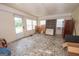 Bright sun room with tile floors, large windows and an air conditioner; offers an outdoor feel at 178 S Old Highway 27, Roopville, GA 30170