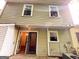 This home features a back exterior with a white door and sliding glass door for easy access at 3150 Stratford Green Pl, Avondale Estates, GA 30002