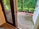 Patio view of lush, manicured backyard featuring garden hedging at 3150 Stratford Green Pl, Avondale Estates, GA 30002