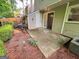 Well-maintained backyard featuring a patio, garden, and established landscaping at 3150 Stratford Green Pl, Avondale Estates, GA 30002