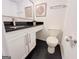 Bathroom featuring a black countertop and updated fixtures and toilet at 3150 Stratford Green Pl, Avondale Estates, GA 30002