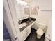 Bathroom featuring a black countertop and updated fixtures at 3150 Stratford Green Pl, Avondale Estates, GA 30002