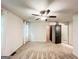 Bright bedroom with carpet flooring, ceiling fan, and access to a walk-in closet and bathroom at 3150 Stratford Green Pl, Avondale Estates, GA 30002