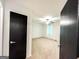 Bedroom features neutral walls and an open door, leading into the light-filled room at 3150 Stratford Green Pl, Avondale Estates, GA 30002