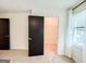 Bedroom with neutral carpet, closet access, and window, providing natural light and storage at 3150 Stratford Green Pl, Avondale Estates, GA 30002