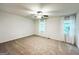 Spacious bedroom featuring neutral carpet, ceiling fan, and natural light from two windows at 3150 Stratford Green Pl, Avondale Estates, GA 30002