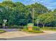 Stratford Green Townhomes community sign surrounded by lush green trees at 3150 Stratford Green Pl, Avondale Estates, GA 30002