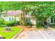 Charming home with well-maintained landscaping, sidewalk, and ample parking providing an inviting curb appeal at 3150 Stratford Green Pl, Avondale Estates, GA 30002