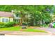 Charming townhome with well-maintained landscaping, flower beds, and a covered front porch at 3150 Stratford Green Pl, Avondale Estates, GA 30002