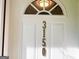 Close-up of the front door with the house number and a decorative window above at 3150 Stratford Green Pl, Avondale Estates, GA 30002