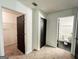 Hallway with access to a walk-in closet and a bathroom with black door frames at 3150 Stratford Green Pl, Avondale Estates, GA 30002