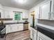 Updated kitchen featuring stainless appliances, wood floors and white cabinetry at 3150 Stratford Green Pl, Avondale Estates, GA 30002