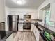 Modern kitchen with stainless steel appliances, granite countertops, and ample cabinet space at 3150 Stratford Green Pl, Avondale Estates, GA 30002