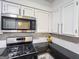 Modern kitchen features stainless steel appliances, black countertops, and white cabinets at 3150 Stratford Green Pl, Avondale Estates, GA 30002