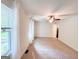Inviting living room with neutral carpet, bright windows, and a ceiling fan for added comfort at 3150 Stratford Green Pl, Avondale Estates, GA 30002