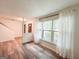 Open-concept living space with a large window, modern flooring, and a view of the entryway at 3150 Stratford Green Pl, Avondale Estates, GA 30002
