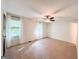 Spacious main bedroom with neutral carpet, ceiling fan, and two windows at 3150 Stratford Green Pl, Avondale Estates, GA 30002