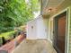 Concrete patio leading to a shed which allows for easy storage and organization for a tidy outdoor space at 3150 Stratford Green Pl, Avondale Estates, GA 30002