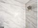 Close-up of a shower featuring gray faux marble tiles and sleek, modern fixtures at 3150 Stratford Green Pl, Avondale Estates, GA 30002