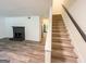 Carpeted staircase leading to the upper level of the home, with view of the living room at 3150 Stratford Green Pl, Avondale Estates, GA 30002
